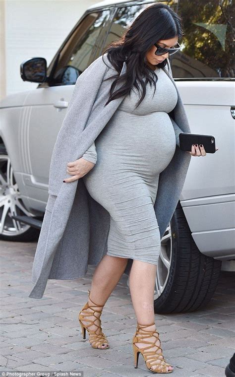 Eight Months Pregnant Kim Kardashian Wears A Skintight Dress And Heels