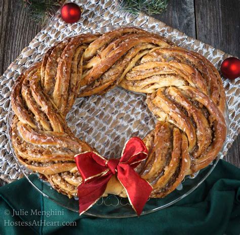 If the mixture is cooling too quickly, set the pan in a skillet with one inch of very hot water to keep the dough manageable. Sweet Nut Holiday Bread Wreath | Hostess At Heart