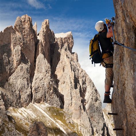 Climber On Via Ferrata In Italy Dolomities Travel Off Path