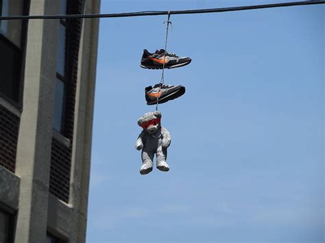 The Mystery Of Sneakers Dangling On The Power Lines Of New York