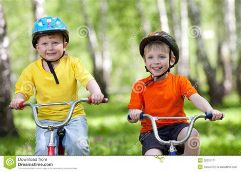 Little Children Riding Their Bikes Stock Image Image