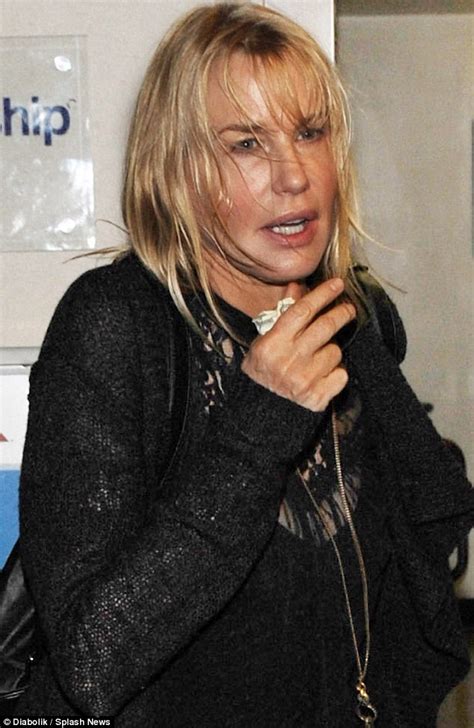 Daryl Hannah Jets Through Airport Wearing Knee Support Brace Daily