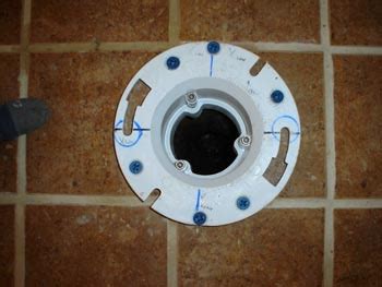 How to properly drill through tiles? Toilet flange over tiled surface - to fasten or not ...