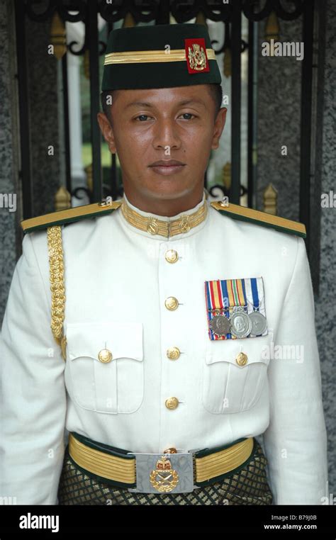A Malaysian Army Officer On Guard Duty Outside The National Palace In