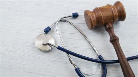 gavel and stethoscope placed next to each other