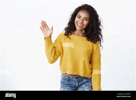 Friendly Cute African American Curly Haired Girl In Yellow Sweater