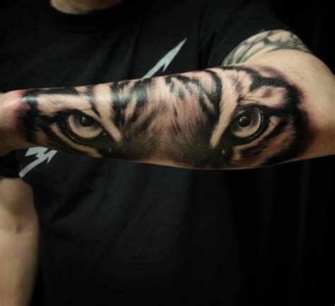 35 Popular Tiger Eyes Arm Band Tattoo