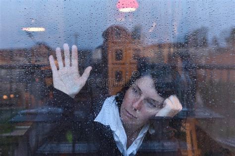 Woman Looking Out The Window On A Rainy Day Stock Photo Image Of