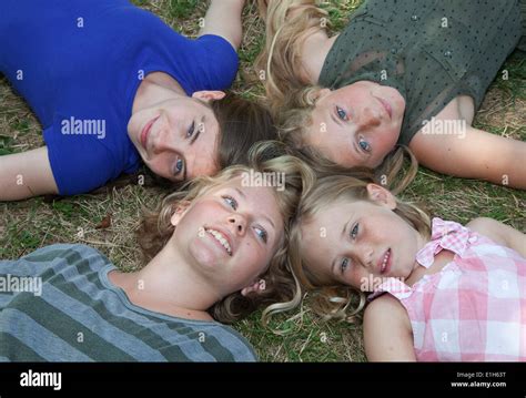 Four Girls Lying On Grass Stock Photo Alamy