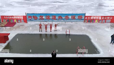 Winter Swimming Enthusiasts Dive Into The Icy Songhua River In Harbin