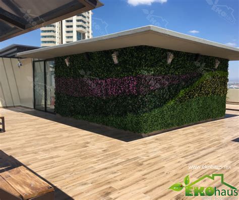 A Green Wall On The Roof Of A Building