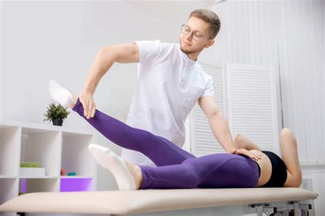 Concept Sports Massage For Athlete Woman Osteopath Therapist Working With Legs Muscle After