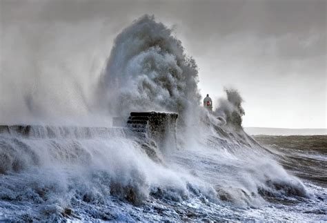 Waves Crashing Against Lighthouse In Porthcawl Wales By Steve