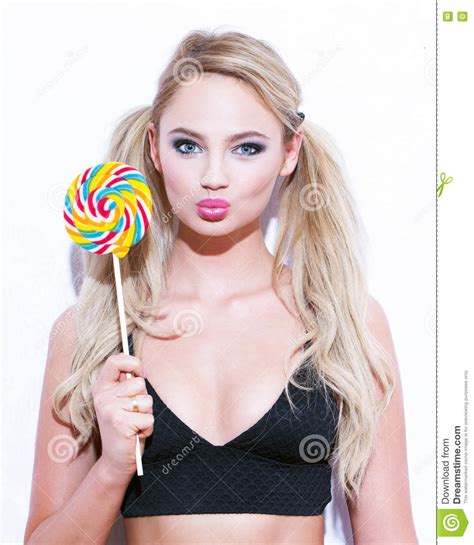 Blonde Woman With Double Ponytails And Lollipop Stock