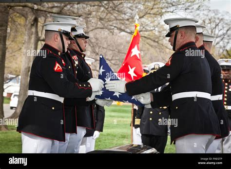 Body Bearers With Marine Barracks Washington Fold A Flag During A Funeral For Retired Gen Earl