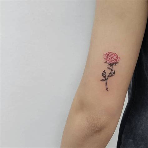 A tiny black rose tattoo in the middle of the right arm. Pin on Floral Tattoos