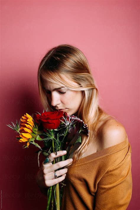 Woman Smelling Flowers By Stocksy Contributor Kayla Snell Stocksy