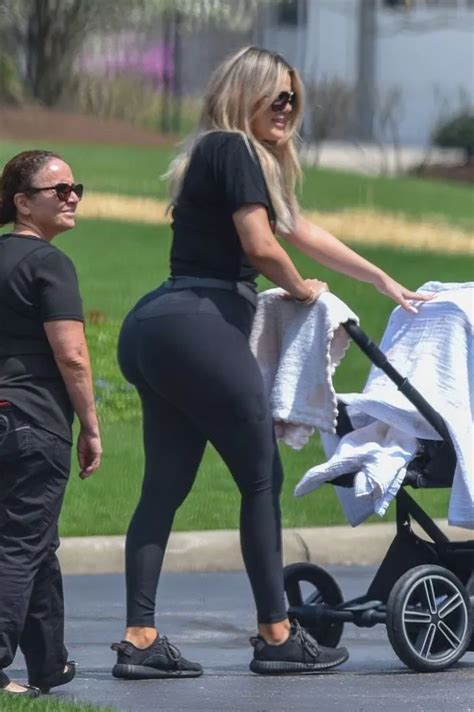 fans convinced khloe kardashian s shapely bum and slim waist are down to surgery as she puts