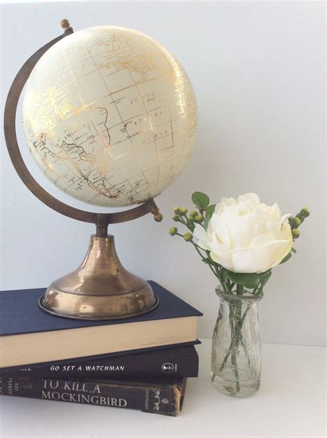 Gold Globe White Globe Mid Sized Brass Base With A Off White Sphere
