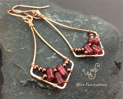 These Handmade Copper Drop Earrings Are A Long Diamond Shaped Frame