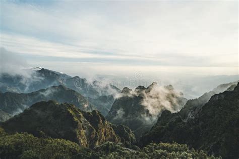 Mountains Surrounded By Clouds Green Mountain Peaks In The White