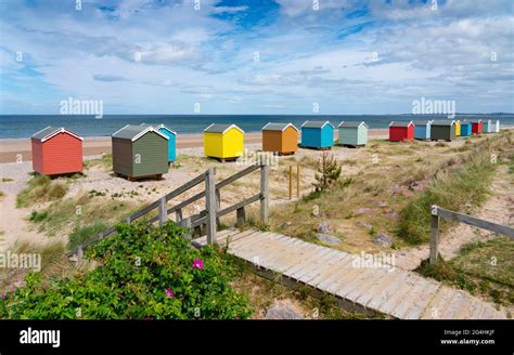 Colourful Beach Huts On Beach At Findhorn In Moray Morayshire
