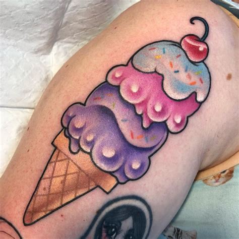 An Ice Cream Cone With Sprinkles And A Cherry On The Tip Is Shown