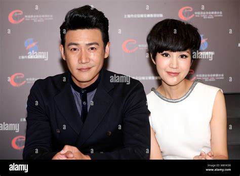 Chinese Actor Lu Yi Left And His Actress Wife Bao Lei Pose During The
