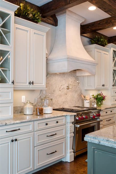We strive to offer the most innovative kitchen and bath design and kitchen remodeling available on the market. Elegant Traditional Kitchen Cabinets and Range Hood | HGTV