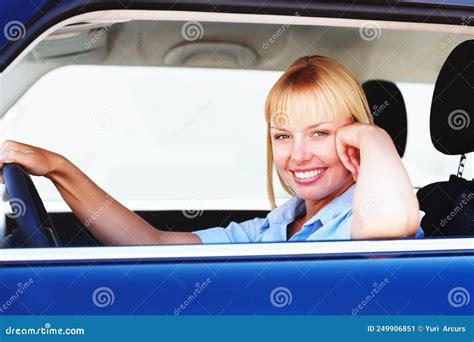 Pretty Woman Smiling From The Drivers Seat Of A Car Smiling Blond