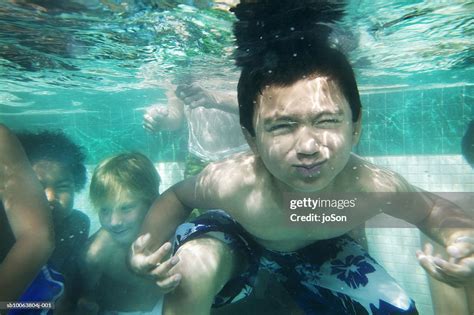Boys Swimming Underwater In Pool High Res Stock Photo Getty Images
