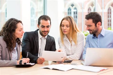 Group Of Business People Working Together At The Office Stock Image