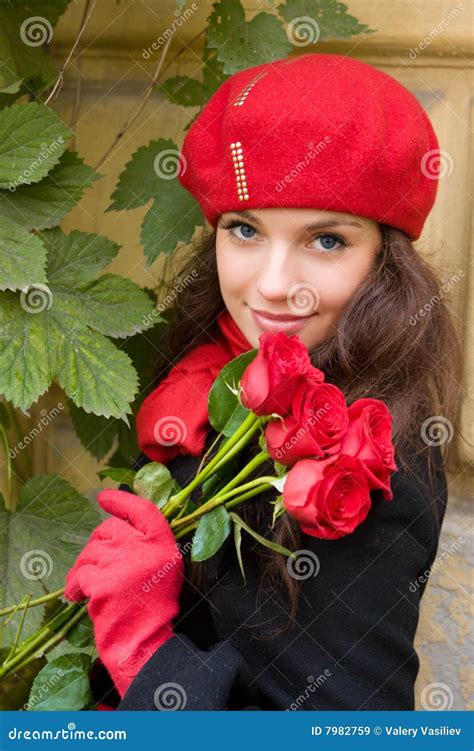 Girl With Dry Roses Behind Wet Glass Stock Image