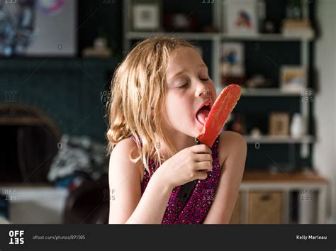 Blonde Girl Licking A Popsicle Stock Photo Offset