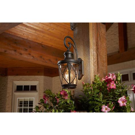 Floodlight cam shines the lights and starts recording as soon as motion is detected. allen + roth | Castine 20-3/8-in H Rubbed Bronze Outdoor ...