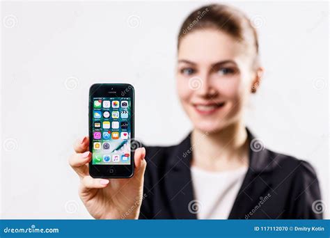 Young Woman Holds Black Apple Iphone 5 Display In Hand Editorial Image