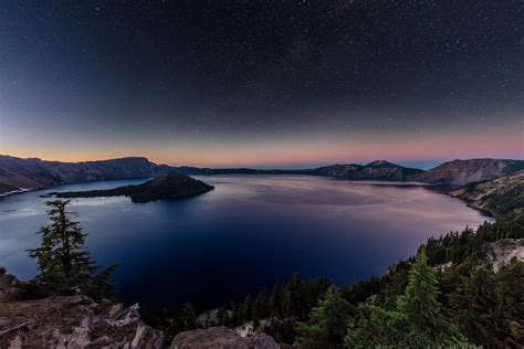 Night Time Stars Over Crater Lake In Crater Lake National Park Oregon