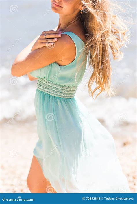 Beautiful Young Blond Woman Outdoors Portrait Near The Sea Or Ocean