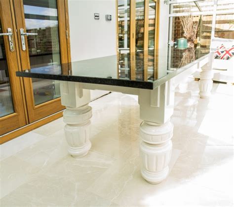 Fronts of the occasional furniture are made of solid wood. Granite Top Dining Tables from £1200 - Slate Furniture Works