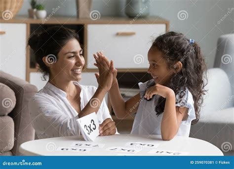 Indian Mother Checks Daughters Skills In Multiplication Stock Image