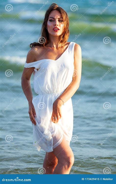 Woman In White Wet Dress Posing In A Sea Waves Stock Image Image Of Blue Ocean 173429415