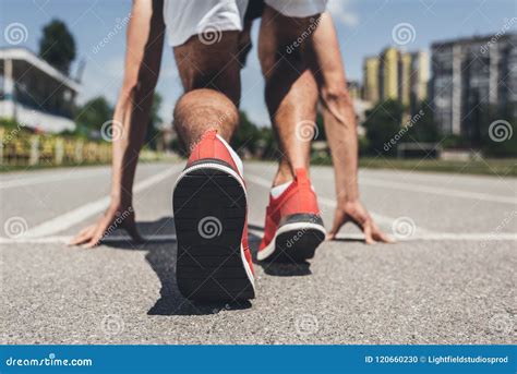 Back View Of Male Sprinter In Starting Position Stock Photo Image Of