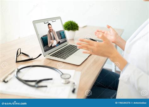 Female Doctor Seeing A Patient Online Stock Photo Image Of Virtual