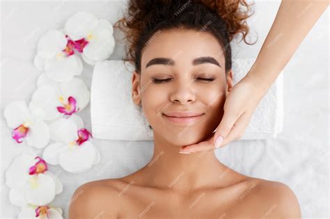 Premium Photo Facial Beauty Treatment Woman Getting Face Massage At Beauty Salon Top View