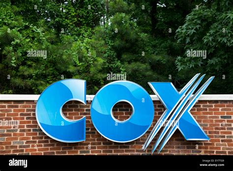 A Logo Sign Outside A Facility Occupied By Cox Communications Inc In