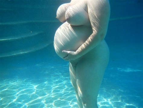Busty Pregnant Babe Floating Underwater Porn Pic