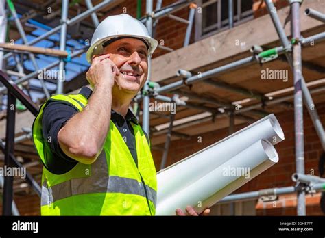 Male Builder Foreman Worker Or Architect On Construction Site Happy