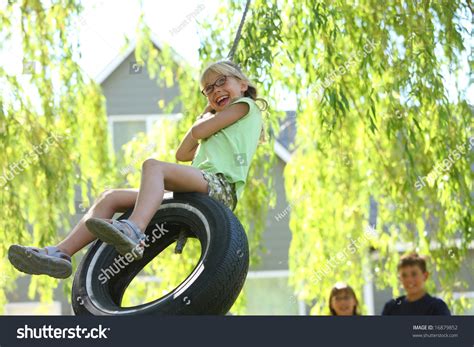Young Girl On Tire Swing Stock Photo 16879852 Shutterstock