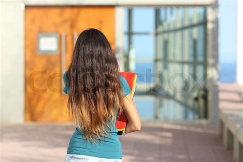 Back View Of A Teen Girl Walking Towards The School Stock Image