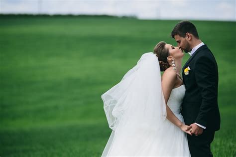 Bride Kissing Her Husbands Lips Outdoors Photo Free Download
